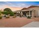 Spacious backyard featuring multiple seating areas and a covered patio for outdoor living at 22274 E Cherrywood Ct, Queen Creek, AZ 85142