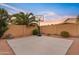 Large backyard with a basketball hoop, lush landscaping, and a desert-friendly environment at 22274 E Cherrywood Ct, Queen Creek, AZ 85142