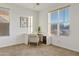 Bright bedroom with carpeted floors, large windows and a modern work space at 22274 E Cherrywood Ct, Queen Creek, AZ 85142