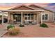 Inviting covered patio with comfortable seating, ceiling fans, and a beautiful sunset view at 22274 E Cherrywood Ct, Queen Creek, AZ 85142