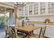 Bright dining area with wood table, stylish chandelier, and decorative built-in cabinetry at 22274 E Cherrywood Ct, Queen Creek, AZ 85142