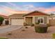 Charming home featuring a well-manicured front yard, a two-car garage, and inviting curb appeal at 22274 E Cherrywood Ct, Queen Creek, AZ 85142