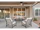 Covered patio featuring comfortable seating, ceiling fan, and well-lit space at 22274 E Cherrywood Ct, Queen Creek, AZ 85142