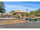 Shaded playground with picnic tables in a well-maintained community park at 22274 E Cherrywood Ct, Queen Creek, AZ 85142