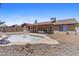 The backyard features a covered patio with a jacuzzi and an empty inground pool at 2247 W Highland St, Chandler, AZ 85224