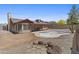 Spacious backyard with empty in-ground pool and patio. Backyard needs some TLC at 2247 W Highland St, Chandler, AZ 85224