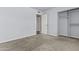 A carpeted bedroom featuring a closet and view into the hallway at 2247 W Highland St, Chandler, AZ 85224