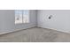 A simply designed bedroom featuring a window and neutral carpeting at 2247 W Highland St, Chandler, AZ 85224