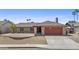 Inviting single story home featuring a two-car garage and desert landscaping for easy maintenance at 2247 W Highland St, Chandler, AZ 85224