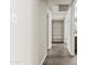 Hallway featuring wood-look flooring and access to other rooms at 2247 W Highland St, Chandler, AZ 85224
