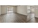 Bright living room featuring wood-look floors and sliding door to a backyard patio at 2247 W Highland St, Chandler, AZ 85224