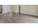 Spacious living area featuring wood-look floors and a bright entry way at 2247 W Highland St, Chandler, AZ 85224