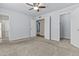 Spacious main bedroom with neutral carpet, walk-in closet and a ceiling fan at 2247 W Highland St, Chandler, AZ 85224