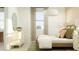 Serene bedroom with a cozy bed, elegant dresser, soft lighting, and minimalist decor at 23356 W Atlanta Ave, Buckeye, AZ 85326