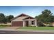Charming single-Gathering home with a symmetrical design, paired garage and well-kept lawn at 23356 W Atlanta Ave, Buckeye, AZ 85326