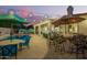 Well-appointed backyard with a sparkling pool, outdoor seating, and an outdoor kitchen with bar seating at 2406 E Oakland St, Chandler, AZ 85225