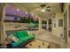 Outdoor patio with comfortable seating, ceiling fan, and a beautiful view of the pool and backyard at 2406 E Oakland St, Chandler, AZ 85225