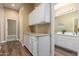 Bright and airy hall bathroom with double sinks, a spacious vanity, and nautical themed decor at 2406 E Oakland St, Chandler, AZ 85225