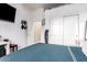 Comfortable bedroom featuring ample closet space, a mounted TV, and minimalist decor, perfect for a relaxing retreat at 2406 E Oakland St, Chandler, AZ 85225