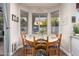 Charming dining nook with a bay window offering lovely views of the outdoor space at 2406 E Oakland St, Chandler, AZ 85225