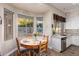 Cozy dining nook with large windows, perfect for enjoying breakfast and views of the outdoor area at 2406 E Oakland St, Chandler, AZ 85225