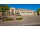 Beautiful one-story home featuring a well-manicured yard and a convenient three-car garage at 2406 E Oakland St, Chandler, AZ 85225