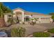 Charming single-story home features a well-manicured yard, desert landscaping, and a large attached three-car garage at 2406 E Oakland St, Chandler, AZ 85225