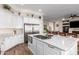 Spacious kitchen with stainless steel appliances, granite counters, large island, and open floor plan at 2406 E Oakland St, Chandler, AZ 85225