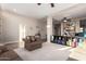 Spacious living room with a seamless blend of carpet and tile flooring, and ample seating at 2406 E Oakland St, Chandler, AZ 85225