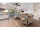 Bright and airy living room featuring tile floors, large windows, and an open floor plan at 2406 E Oakland St, Chandler, AZ 85225