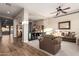 Open-concept living space showcasing a mix of carpet and wood-look tile flooring with ample natural light at 2406 E Oakland St, Chandler, AZ 85225