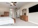 Spacious primary bedroom featuring a ceiling fan, ensuite bathroom, and classic wooden furniture at 2406 E Oakland St, Chandler, AZ 85225