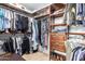 Spacious walk-in closet featuring custom wood shelving and ample storage space for clothes, shoes, and accessories at 2406 E Oakland St, Chandler, AZ 85225