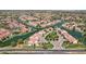 Expansive aerial view of homes with red tiled roofs nestled around a scenic lake and beautifully landscaped neighborhood at 2454 W Hope Cir, Chandler, AZ 85248