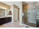 Bathroom with a glass-enclosed shower, a single vanity, and light wood-look tile floors at 2454 W Hope Cir, Chandler, AZ 85248