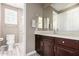 Bathroom featuring dark cabinets, wood-look tile flooring, and a glass-enclosed shower at 2454 W Hope Cir, Chandler, AZ 85248