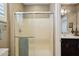 Bathroom featuring a glass shower, a dark wood vanity and ample counter space at 2454 W Hope Cir, Chandler, AZ 85248