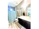 Bathroom featuring tile flooring, a double vanity, a toilet, and a tiled shower with a patterned shower curtain at 2454 W Hope Cir, Chandler, AZ 85248