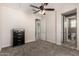 Carpeted bedroom with neutral walls and multiple doors to connecting rooms at 2454 W Hope Cir, Chandler, AZ 85248
