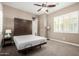 Comfortable bedroom showcasing a murphy bed and window with shutters, offering a relaxing space at 2454 W Hope Cir, Chandler, AZ 85248