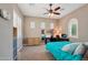 Inviting bedroom with a ceiling fan, a cozy workspace, and neutral tones at 2454 W Hope Cir, Chandler, AZ 85248