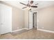 Neutral bedroom featuring a ceiling fan, neutral walls and carpeted floors, providing a cozy and inviting atmosphere at 2454 W Hope Cir, Chandler, AZ 85248
