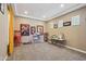 A spacious bonus room with movie posters, neutral walls, carpet floors, and a vintage popcorn machine at 2454 W Hope Cir, Chandler, AZ 85248