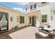 Inviting outdoor courtyard with brick pavers, comfortable seating, and charming architectural details at 2454 W Hope Cir, Chandler, AZ 85248