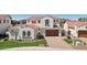 Charming two-story home featuring a red tile roof, well-manicured lawn, and a two-car garage at 2454 W Hope Cir, Chandler, AZ 85248