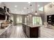 Open concept kitchen with granite countertops, stainless steel appliances, and large island at 2454 W Hope Cir, Chandler, AZ 85248
