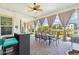 Back patio overlooking a tranquil pond, featuring a dining set and a bar area with comfortable seating at 2454 W Hope Cir, Chandler, AZ 85248