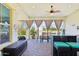 Covered patio overlooking a pond with outdoor seating and a bar area, perfect for relaxing and entertaining at 2454 W Hope Cir, Chandler, AZ 85248