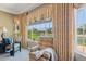 A sitting area with a recliner chair with views of the lake and custom drapes at 2454 W Hope Cir, Chandler, AZ 85248