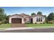 Charming single-story home features a tile roof, stucco exterior, and a spacious two-car garage at 25162 N 177Th Dr, Surprise, AZ 85387